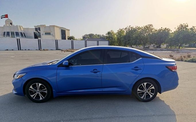 Nissan Sentra VIII (B18), 2021  sedan for rent in Dubai by more rent a car, blue color | AUTO.AE