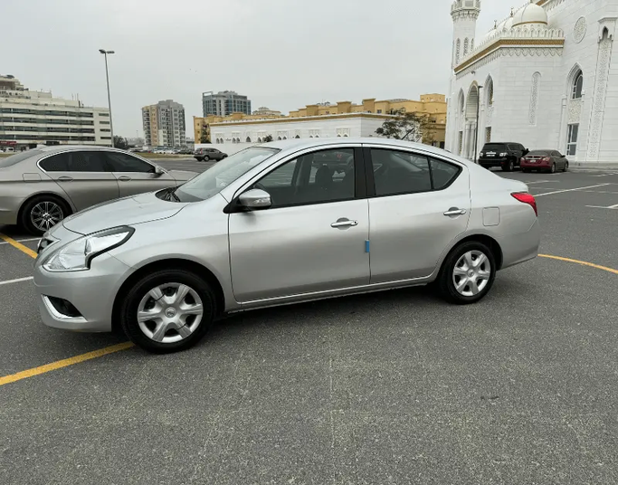 Nissan Sunny N17 Facelift, 2023  sedan for rent in Dubai by Left lane rent a car llc, silver color | AUTO.AE