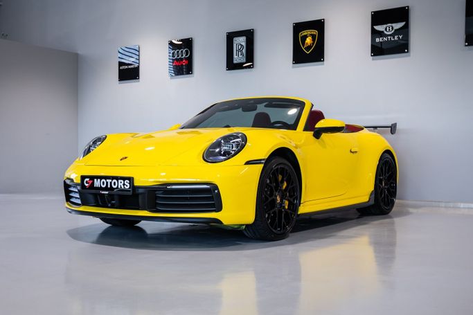 Подержанный Porsche 911 Carrera 4S VIII (992), 3.0 л, 2020 в Дубае от C7 Motors Желтый цвет. Корейская | AUTO.AE