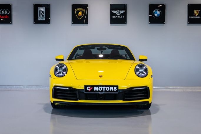 Подержанный Porsche 911 Carrera 4S VIII (992), 3.0 л, 2020 в Дубае от C7 Motors Желтый цвет. Корейская | AUTO.AE