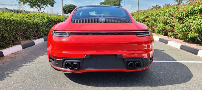 Used Porsche 911 Carrera 4 VIII (992), 3.0 l, 2021 in Dubai by Space Motors, Red color. American Specs | AUTO.AE