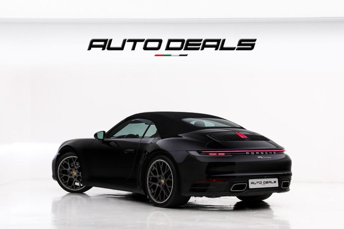 Подержанный Porsche 911 Carrera VIII (992), 3.0 л, 2023 в Дубае от AUTO DEALS Черный цвет. GCC | AUTO.AE