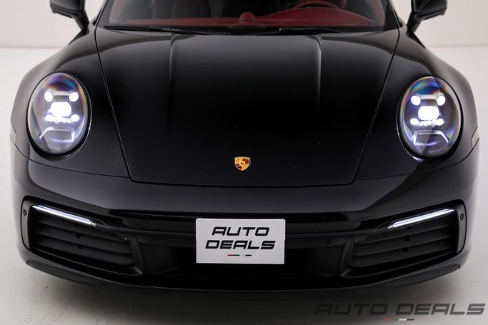 Подержанный Porsche 911 Carrera VIII (992), 3.0 л, 2023 в Дубае от AUTO DEALS Черный цвет. GCC | AUTO.AE