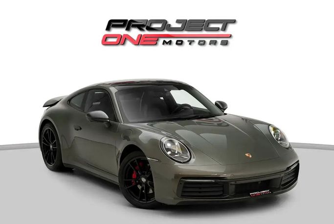 Подержанный Porsche 911 Carrera 4 VIII (992), 3.0 л, 2021 в Дубае от Project One Motors Зеленый цвет. Европейская | AUTO.AE