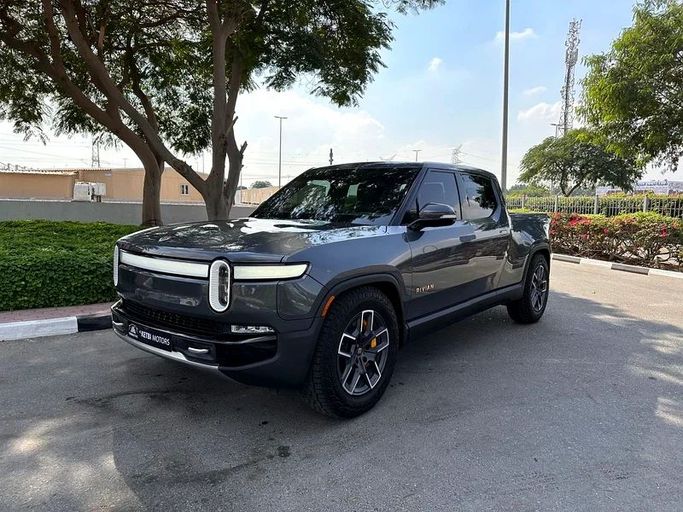Used Rivian R1T, 2023 in Dubai by Al Ketbi Motors, Grey color. American Specs | AUTO.AE