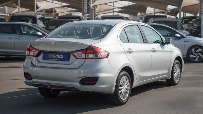 Подержанный Suzuki Ciaz I Рестайлинг, 1.5 л, 2024 в Дубае от Cariva Used Cars  Серый цвет. GCC | AUTO.AE