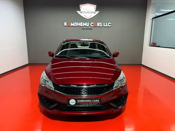 Подержанный Suzuki Ciaz I Рестайлинг, 1.5 л, 2023 в Дубае от Kamdhenu Cars Красный цвет. GCC | AUTO.AE
