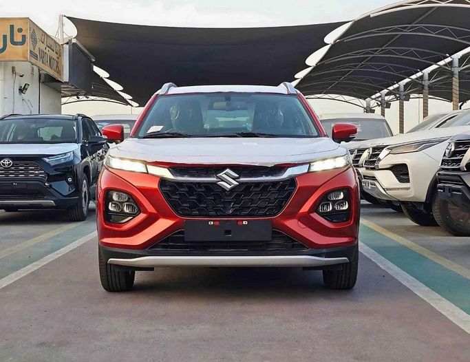 New Suzuki Fronx, 1.5 l, 2025 in Dubai by SK Motors, Orange color. GCC Specs | AUTO.AE