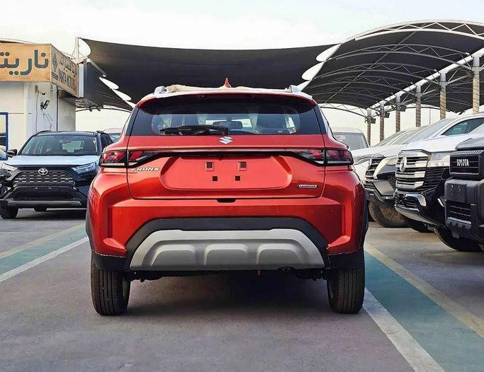 New Suzuki Fronx, 1.5 l, 2025 in Dubai by SK Motors, Orange color. GCC Specs | AUTO.AE