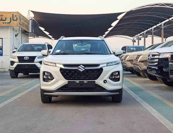 New Suzuki Fronx, 1.5 l, 2025 in Dubai by SK Motors, White color. GCC Specs | AUTO.AE