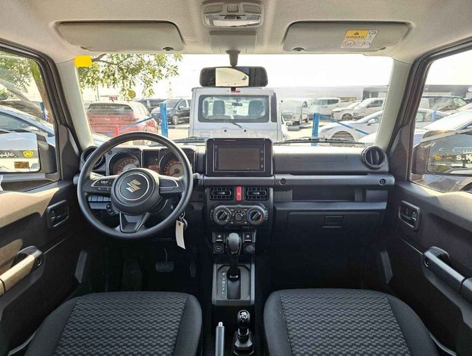 New Suzuki Jimny IV, 1.5 l, 2024 in Dubai by SK Motors, Grey color. GCC Specs | AUTO.AE