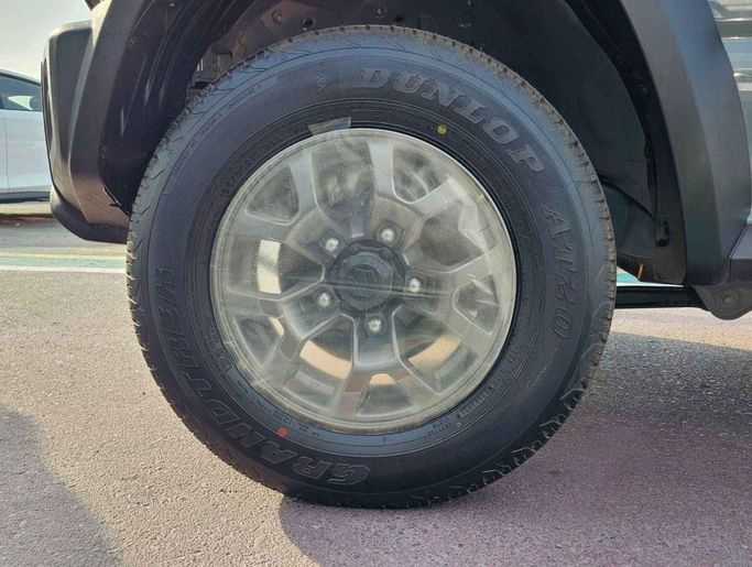 New Suzuki Jimny IV, 1.5 l, 2024 in Dubai by SK Motors, Grey color. GCC Specs | AUTO.AE