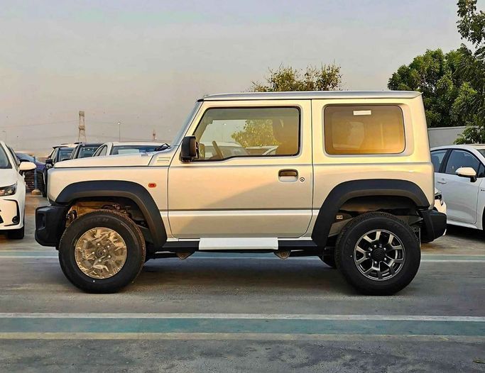 New Suzuki Jimny IV, 1.5 l, 2025 in Dubai by SK Motors, Silver color. GCC Specs | AUTO.AE