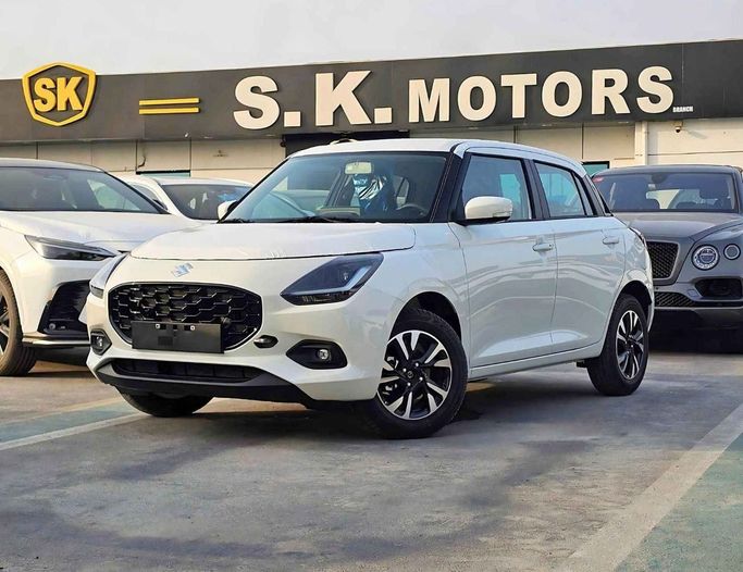 New Suzuki Swift VI, 1.2 l, 2025 in Dubai by SK Motors, White color. GCC Specs | AUTO.AE