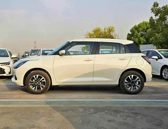New Suzuki Swift VI, 1.2 l, 2025 in Dubai by SK Motors, White color. GCC Specs | AUTO.AE