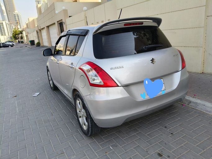 Подержанный Suzuki Swift V, 1.4 л, 2016 в Дубае Серебристый цвет. GCC | AUTO.AE