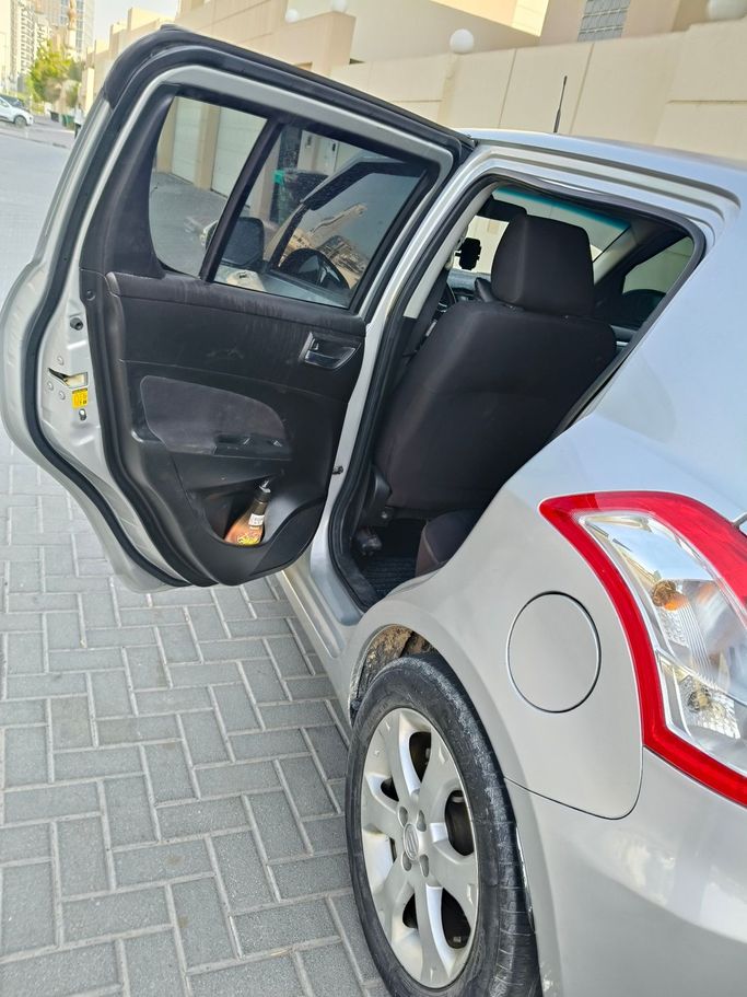 Подержанный Suzuki Swift V, 1.4 л, 2016 в Дубае Серебристый цвет. GCC | AUTO.AE