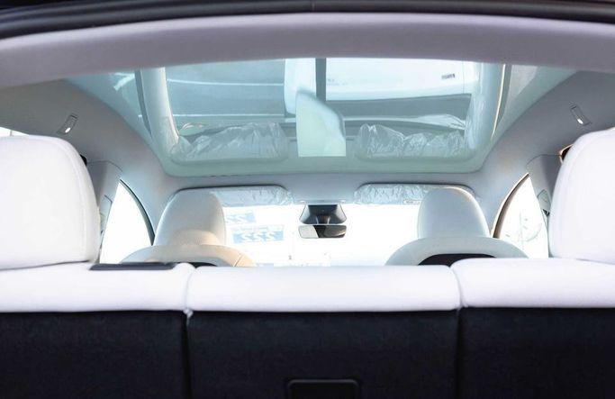 New Tesla Model Y Long Range I Facelift, 2025 in Dubai by Albakheet Motors, White color. Chinese Specs | AUTO.AE