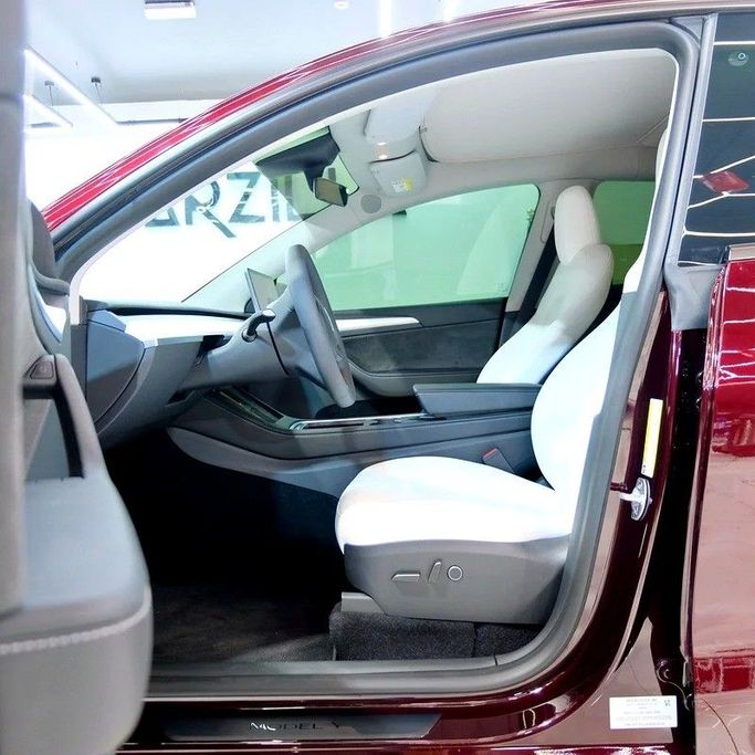 Used Tesla Model Y Long Range I, 2023 in Dubai by Carzilla Motors, Burgundy color. GCC Specs | AUTO.AE