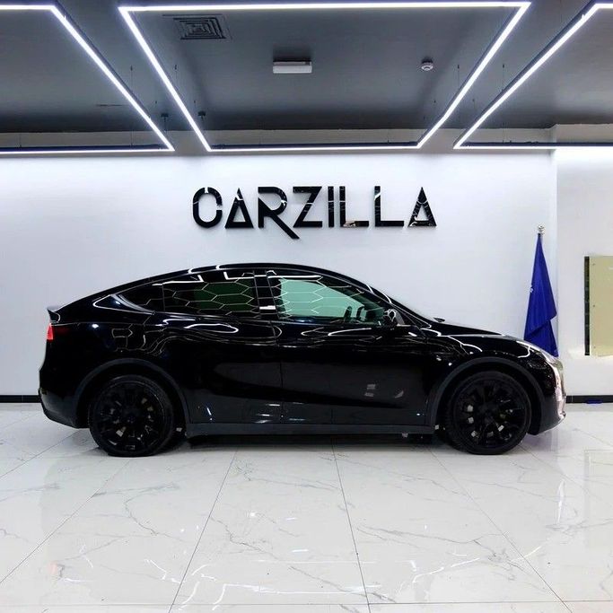 Used Tesla Model Y Long Range I, 2023 in Dubai by Carzilla Motors, Black color. GCC Specs | AUTO.AE