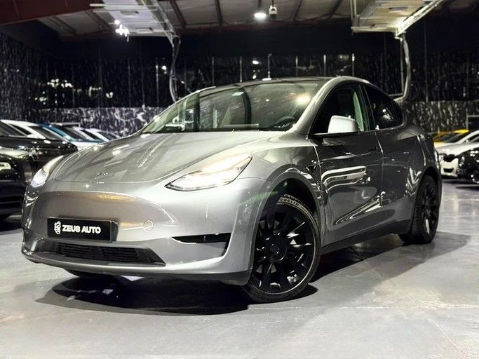 Used Tesla Model Y Performance I, 2024 in Dubai by Zeus Motors, Grey color. GCC Specs | AUTO.AE