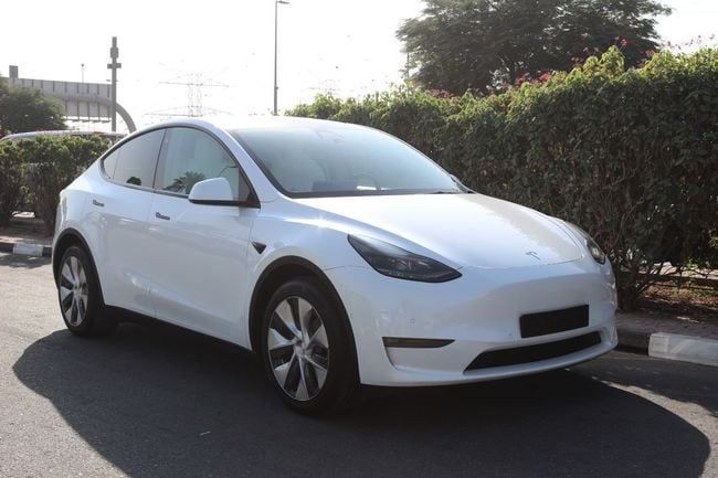 Used Tesla Model Y Long Range I, 2022 in Dubai by Power Wagon Motors, White color. GCC Specs | AUTO.AE