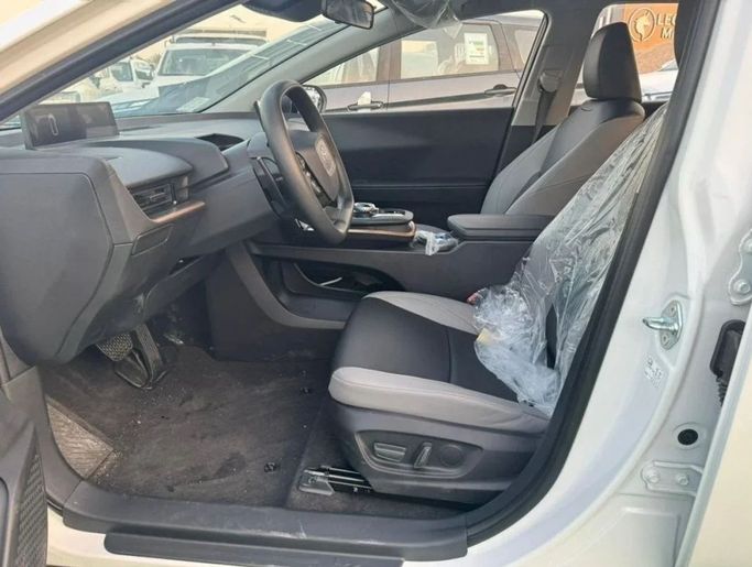 New Toyota bZ3, 2024 in Dubai by Mohamed Hakim Motors, White color. Chinese Specs | AUTO.AE