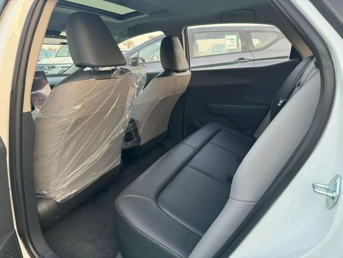 New Toyota bZ3, 2024 in Dubai by Mohamed Hakim Motors, White color. Chinese Specs | AUTO.AE