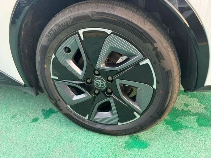 New Toyota bZ3, 2024 in Dubai by Mohamed Hakim Motors, White color. Chinese Specs | AUTO.AE