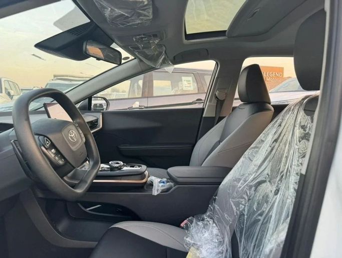 New Toyota bZ3, 2024 in Dubai by Mohamed Hakim Motors, White color. Chinese Specs | AUTO.AE