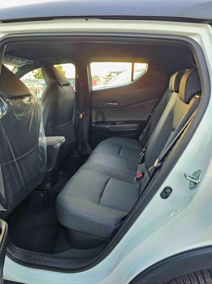 New Toyota C-HR II, 1.8 l, 2023 in Dubai by SK Motors, White color. GCC Specs | AUTO.AE