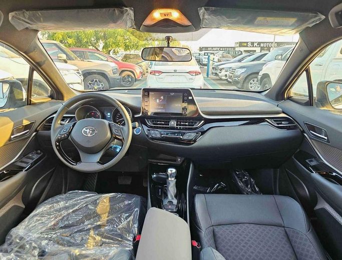 New Toyota C-HR II, 1.8 l, 2023 in Dubai by SK Motors, White color. GCC Specs | AUTO.AE