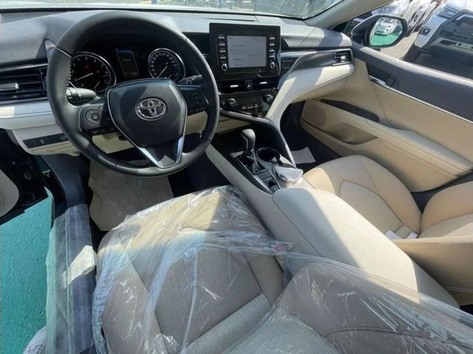 New Toyota Camry IX (XV80), 2.5 l, 2024 in Dubai by Mohamed Hakim Motors, Black color. GCC Specs | AUTO.AE