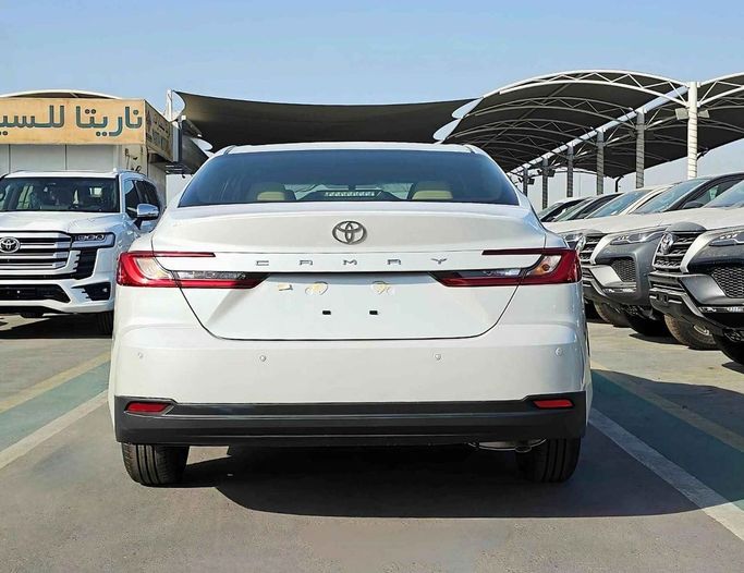 New Toyota Camry IX (XV80), 2.5 l, 2025 in Dubai by SK Motors, White color. GCC Specs | AUTO.AE
