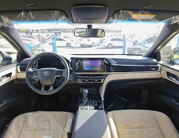 New Toyota Camry IX (XV80), 2.5 l, 2025 in Dubai by SK Motors, White color. GCC Specs | AUTO.AE
