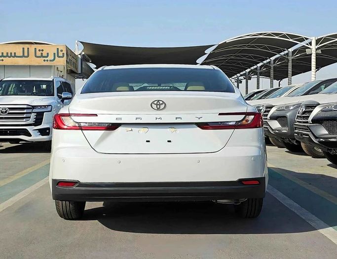 New Toyota Camry IX (XV80), 2.5 l, 2025 in Dubai by SK Motors, White color. GCC Specs | AUTO.AE
