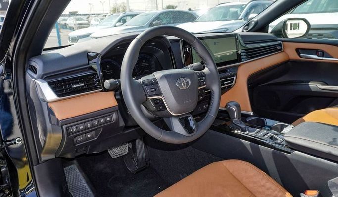 New Toyota Camry IX (XV80), 2.5 l, 2025 in Dubai by Najem Motors, Black color. GCC Specs | AUTO.AE