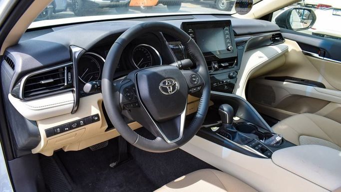 New Toyota Camry IX (XV80), 2.5 l, 2024 in Dubai by Najem Motors, White color. GCC Specs | AUTO.AE