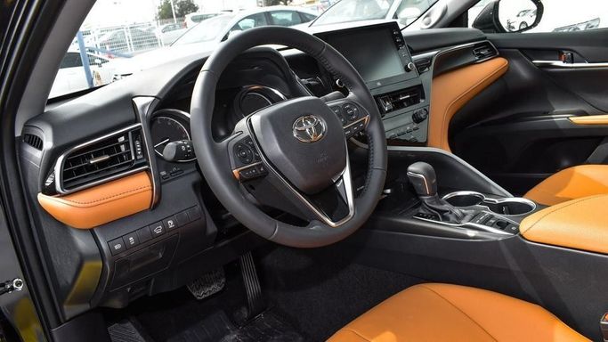 New Toyota Camry IX (XV80), 2.5 l, 2024 in Dubai by Najem Motors, Black color. GCC Specs | AUTO.AE