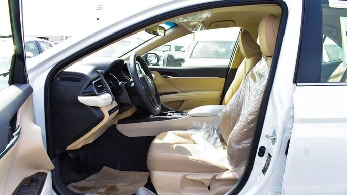 New Toyota Camry VIII (XV70) Facelift, 2.5 l, 2023 in Dubai by Najem Motors, White color. GCC Specs | AUTO.AE