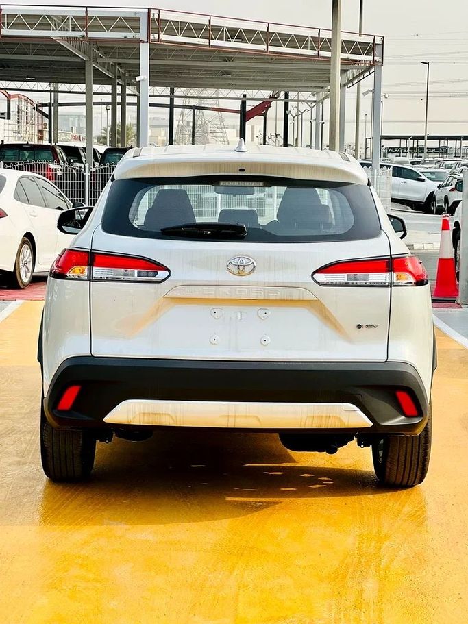 New Toyota Corolla Cross I, 2.0 l, 2020 in Dubai by ANDIAMO MOTORS FZE, White color. Chinese Specs | AUTO.AE