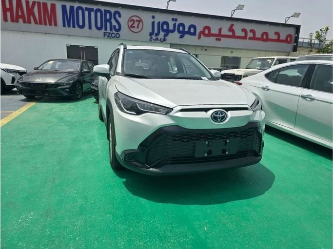 New Toyota Corolla Cross I, 2.0 l, 2024 in Dubai by Mohamed Hakim Motors, White color. Chinese Specs | AUTO.AE