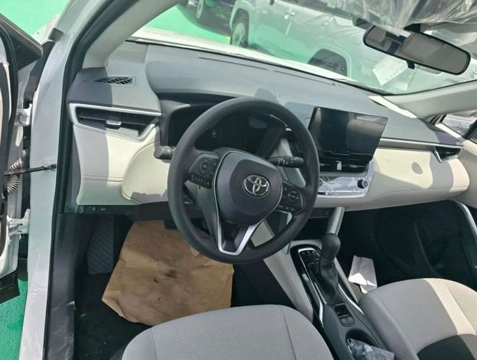 New Toyota Corolla Cross I, 2.0 l, 2024 in Dubai by Mohamed Hakim Motors, White color. Chinese Specs | AUTO.AE
