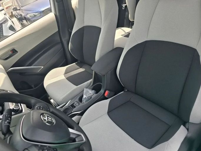 New Toyota Corolla Cross I, 2.0 l, 2024 in Dubai by Mohamed Hakim Motors, White color. Chinese Specs | AUTO.AE