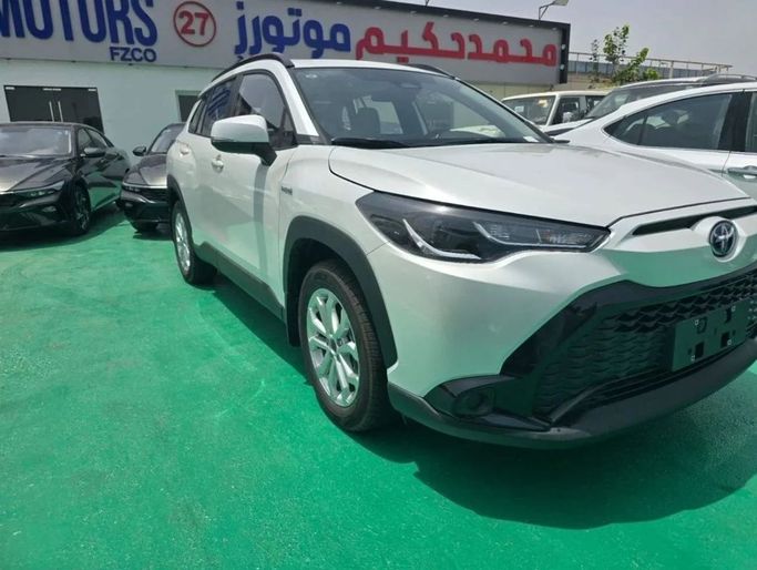 New Toyota Corolla Cross I, 2.0 l, 2024 in Dubai by Mohamed Hakim Motors, White color. Chinese Specs | AUTO.AE