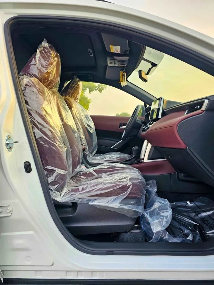 New Toyota Corolla Cross I, 1.8 l, 2024 in Dubai by SK Motors, White color. GCC Specs | AUTO.AE