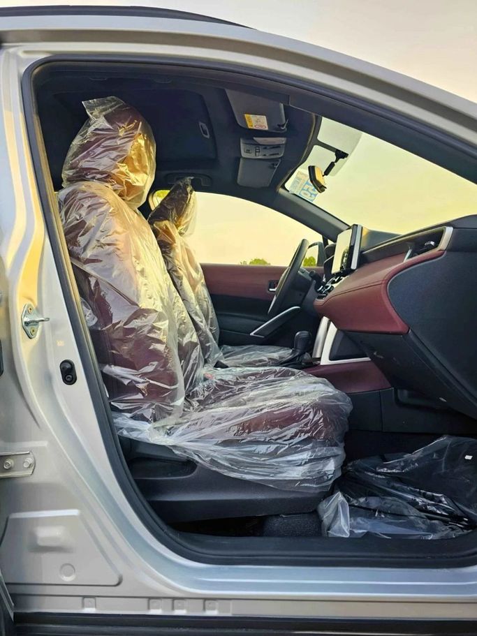 New Toyota Corolla Cross I, 1.8 l, 2024 in Dubai by SK Motors, Silver color. GCC Specs | AUTO.AE