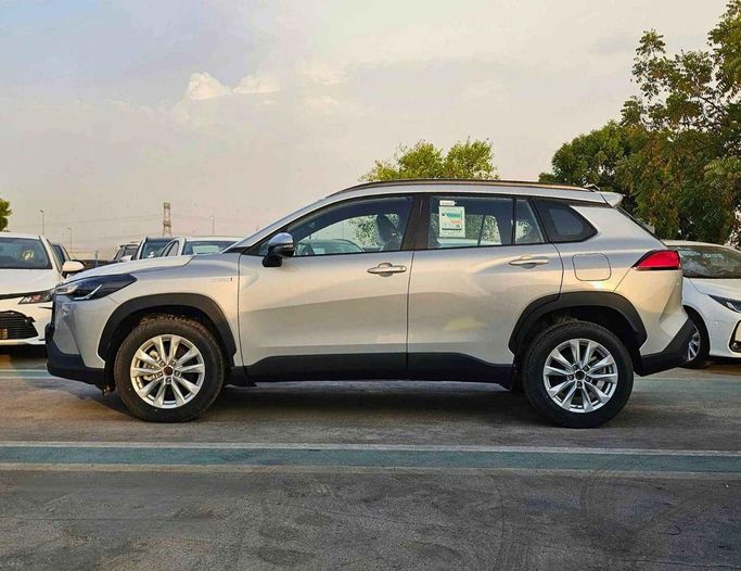 New Toyota Corolla Cross I, 1.8 l, 2024 in Dubai by SK Motors, Silver color. GCC Specs | AUTO.AE
