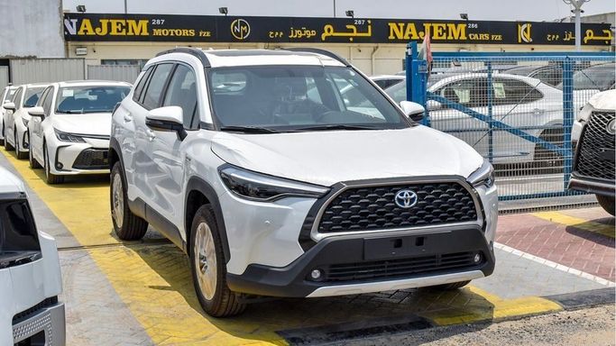 New Toyota Corolla Cross I, 1.8 l, 2024 in Dubai by Najem Motors, White color. GCC Specs | AUTO.AE