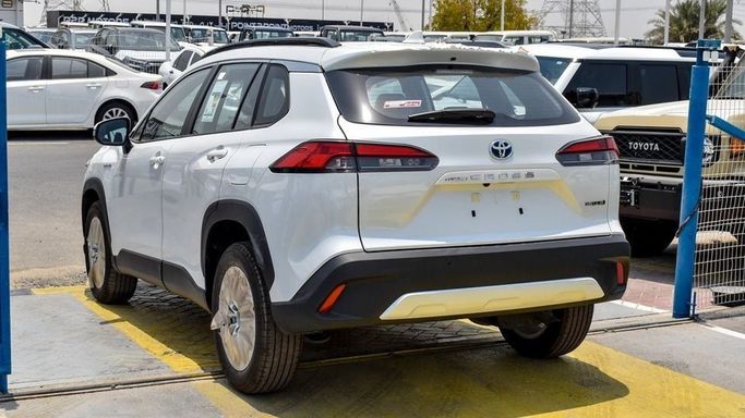 New Toyota Corolla Cross I, 1.8 l, 2024 in Dubai by Najem Motors, White color. GCC Specs | AUTO.AE